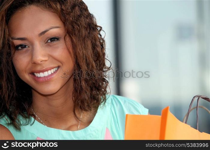 beautiful young woman holding a shopping bag