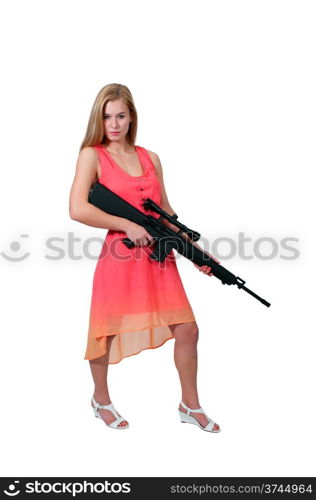 Beautiful young woman holding an automatic assault rifle