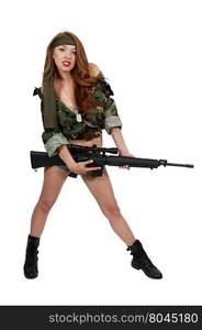 Beautiful young woman holding an automatic assault rifle