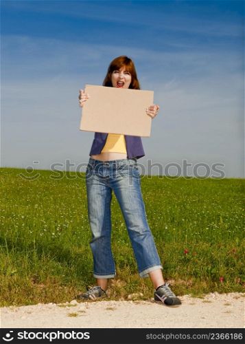 Beautiful young woman holding blank paper card