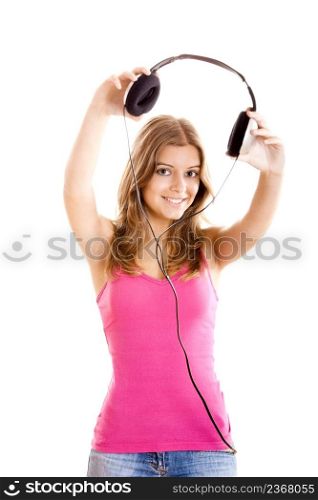 Beautiful young woman holding headphones isolated on white