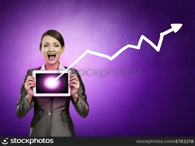 Beautiful young woman holding tablet pc with graph against her face. Woman with tablet