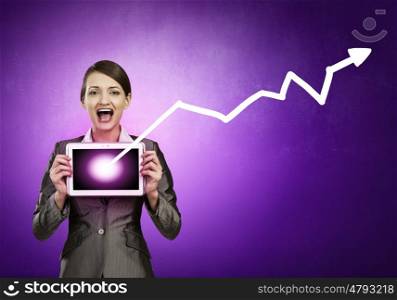 Beautiful young woman holding tablet pc with graph against her face. Woman with tablet