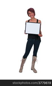 Beautiful young woman holding up a blank sign