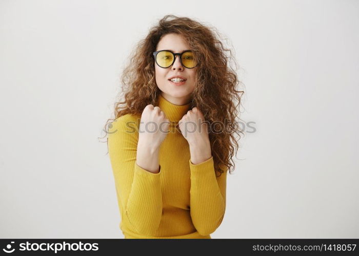 Beautiful young woman in a boxer stand posing on a grey background. Women&rsquo;s power and equality - concept. Beautiful young woman in a boxer stand posing on a grey background. Women&rsquo;s power and equality - concept.