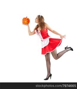 Beautiful young woman in a costume of sexy maid holding halloween pumpkin.