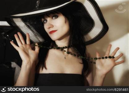 beautiful young woman in a wide-brimmed hat