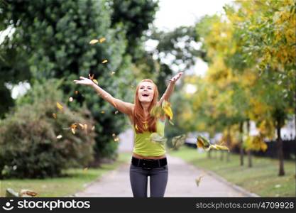Beautiful young woman in autumn park