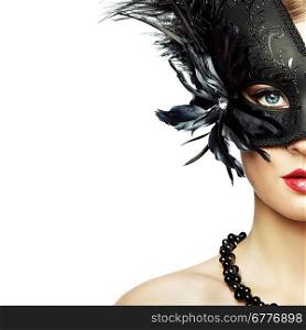 Beautiful young woman in black mysterious venetian mask. Fashion photo