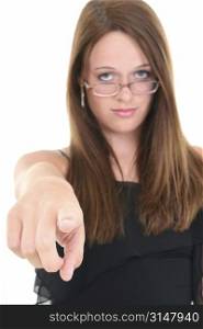Beautiful Young Woman In Glasses Pointing Towards Camera. Focus on tip of finger.