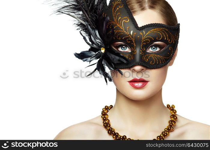 Beautiful young Woman in Mysterious Black Venetian Mask. Fashion photo. Masquerade Mask with Black Feathers