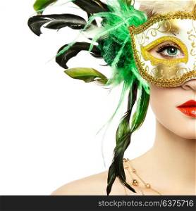 Beautiful young Woman in Mysterious Golden Venetian Mask. Fashion photo. Masquerade Mask with Green Feathers