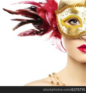 Beautiful young Woman in Mysterious Golden Venetian Mask. Fashion photo. Masquerade Mask with Red Feathers