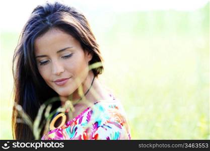 Beautiful young woman in nature