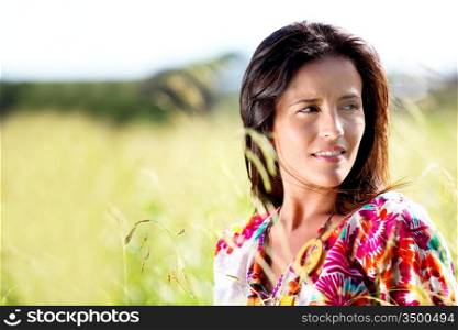 Beautiful young woman in nature landscape