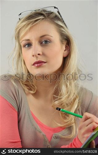 Beautiful young woman in study room
