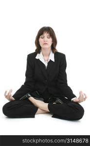 Beautiful young woman in suit meditating.