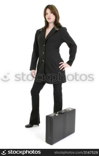 Beautiful young woman in suit with briefcase. Standing over white background.
