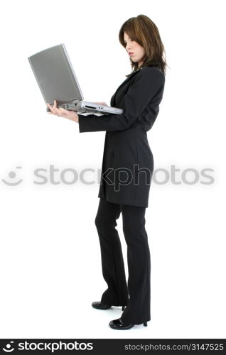 Beautiful young woman in suit with laptop computer. Standing over white background.