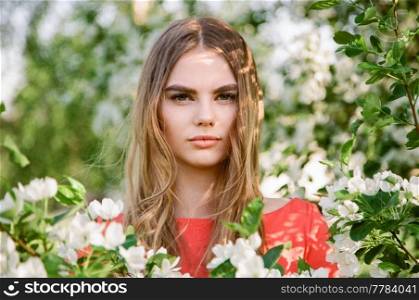 Beautiful young woman in summer garden. Beauty summertime. Film photography