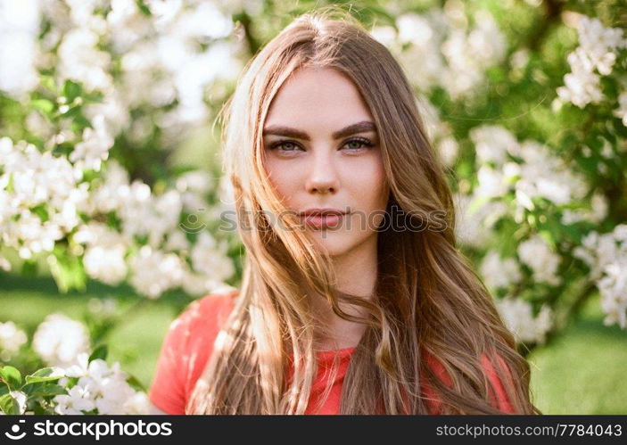 Beautiful young woman in summer garden. Beauty summertime. Film photography