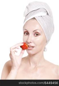 beautiful young woman in towel with a strawberry, isolated on white background