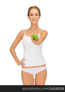 beautiful young woman in white underwear holding green apple