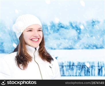 Beautiful young woman in winter clothing outdoors