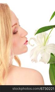 beautiful young woman kissing lily flower, close-up portrait