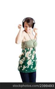 Beautiful young woman listen music and dancing with headphones, isolated on white