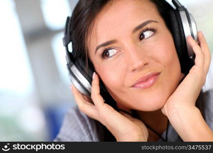 Beautiful young woman listening to music