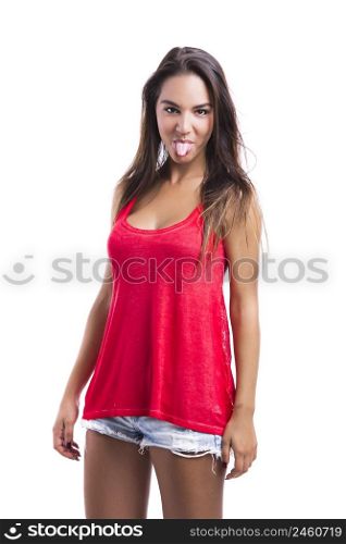 Beautiful young woman making a grimace with her tongue off, isolated over a white background