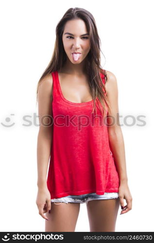 Beautiful young woman making a grimace with her tongue off, isolated over a white background