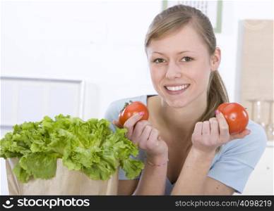 Beautiful young woman making vegetarian vegetable salad