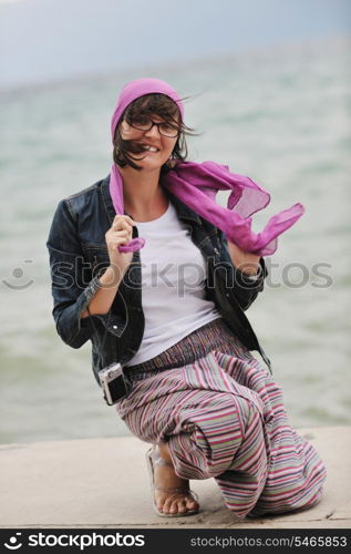 beautiful young woman on beach with scarf relax smile and have fun