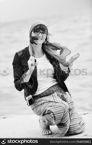 beautiful young woman on beach with scarf relax smile and have fun