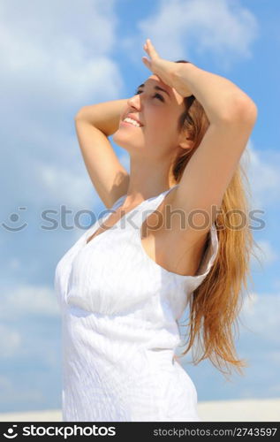 beautiful young woman on the sunny beach