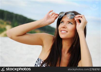 beautiful young woman on the sunny beach