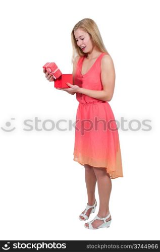 Beautiful young woman opening a valentines gift or present. Balloons