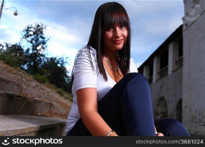 beautiful young woman outdoors old stairs