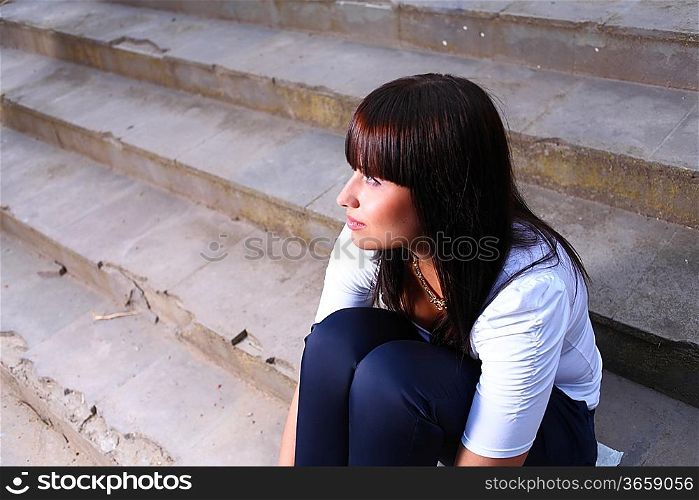 beautiful young woman outdoors on stairs