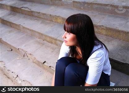 beautiful young woman outdoors on stairs