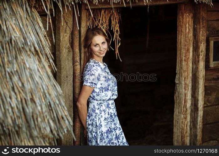 beautiful Young woman outdoors portrait. Portrait of a beautiful girl against a tree house. beautiful Young woman outdoors portrait. Portrait of a beautiful girl against a tree house.