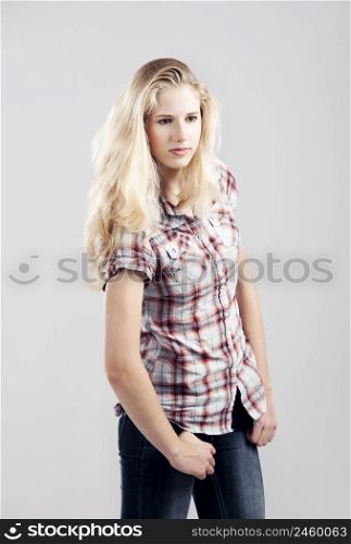 Beautiful young woman over a gray background
