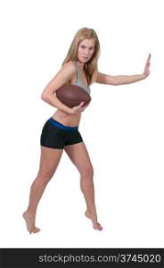 beautiful young woman playing a game of football running with the ball