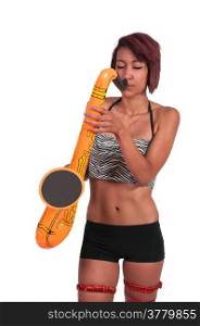 Beautiful young woman playing a toy saxaphone