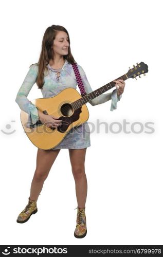 Beautiful young woman playing an acoustic guitar