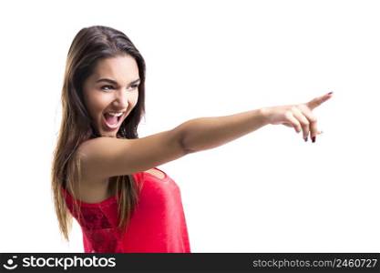 Beautiful young woman pointing to something, isolated over a white background