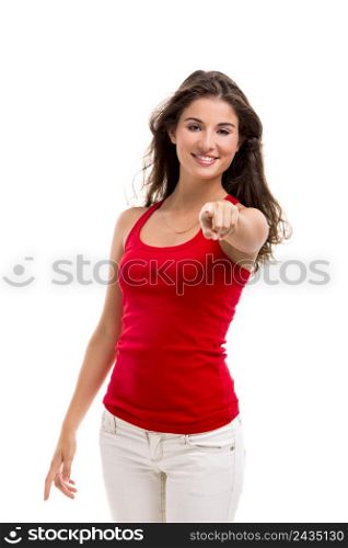 Beautiful young woman pointing to somewhere, isolated over a white background