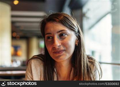 Beautiful Young Woman Portrait In Restaurant